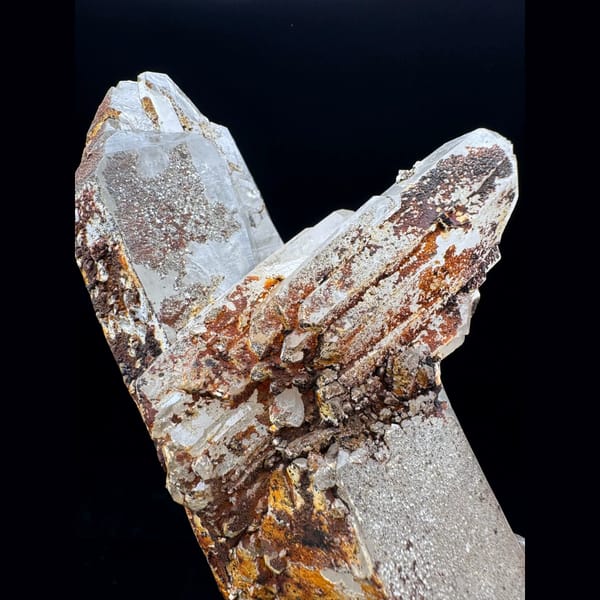Large Himalayan quartz floater from Tibet on a wood stand — detail view