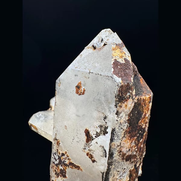 Large Himalayan quartz floater from Tibet on a wood stand — detail view