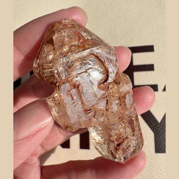 Red mud skeletal double-terminated quartz from Madagascar — alternate view