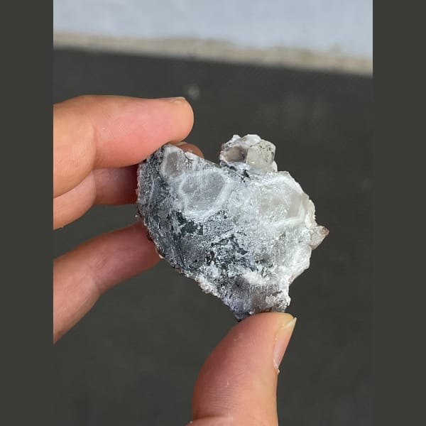 Clear quartz with bladed calcite from Fujian — detail view