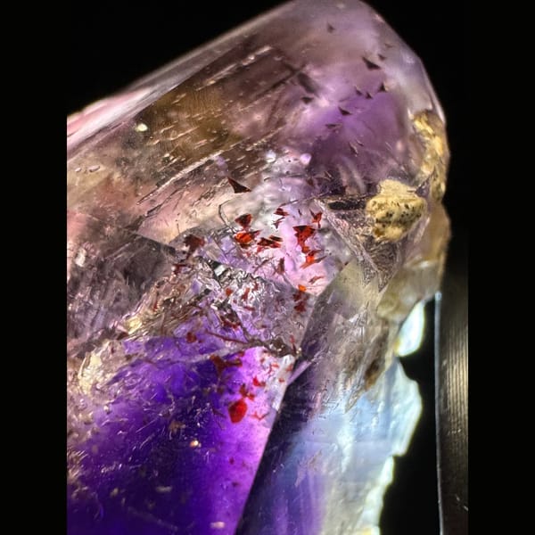 Phantom amethyst cluster with red inclusions from Namibia — detail view