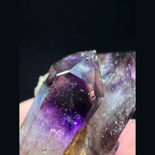Phantom amethyst cluster with red inclusions from Namibia — detail view