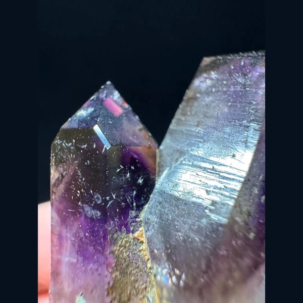 Phantom amethyst cluster with red inclusions from Namibia — detail view