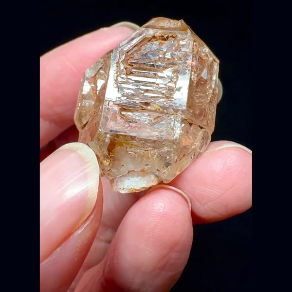 Red mud skeletal windowed quartz from Madagascar — alternate view