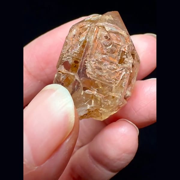 Red mud skeletal windowed quartz from Madagascar — alternate view