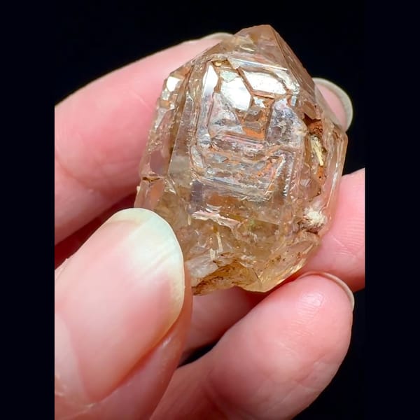 Red mud skeletal windowed quartz from Madagascar — detail view