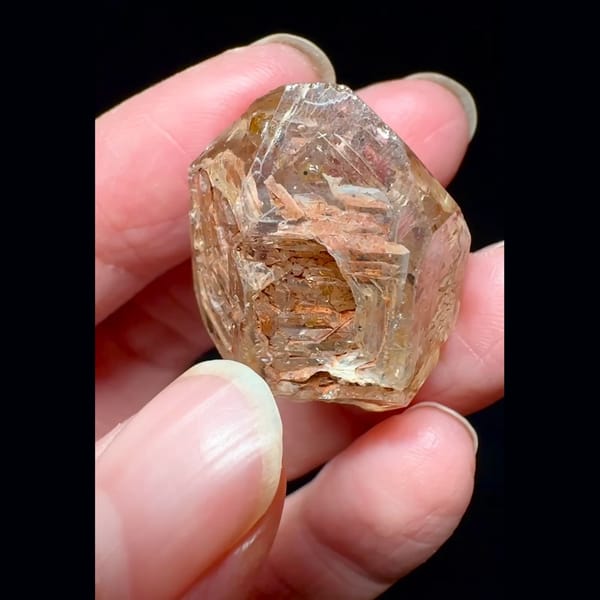 Red mud skeletal windowed quartz from Madagascar — detail view