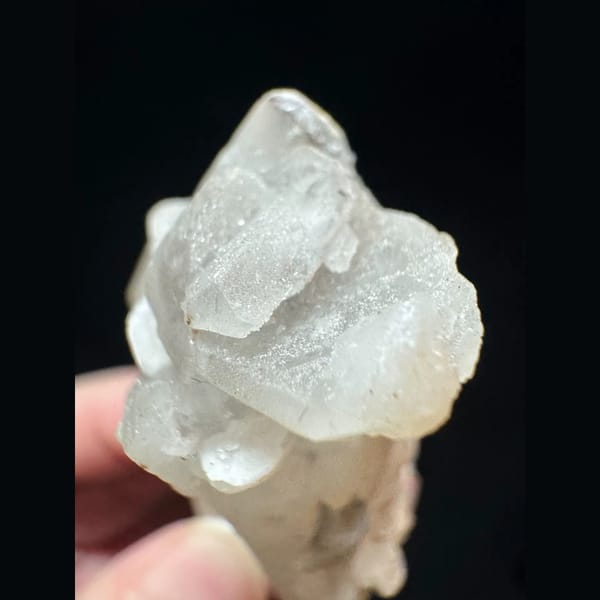 Quartz floater with pink petal calcite from Inner Mongolia — detail view