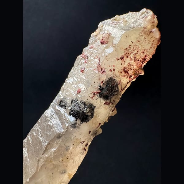Quartz floater with specular hematite from Inner Mongolia — detail view