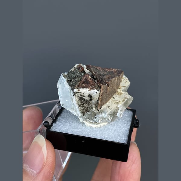 Brown helvite crystals on white calcite from Inner Mongolia — detail view