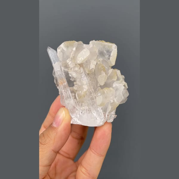 Glassy quartz cluster with white barite blades from Jinkouhe, Sichuan — complete view