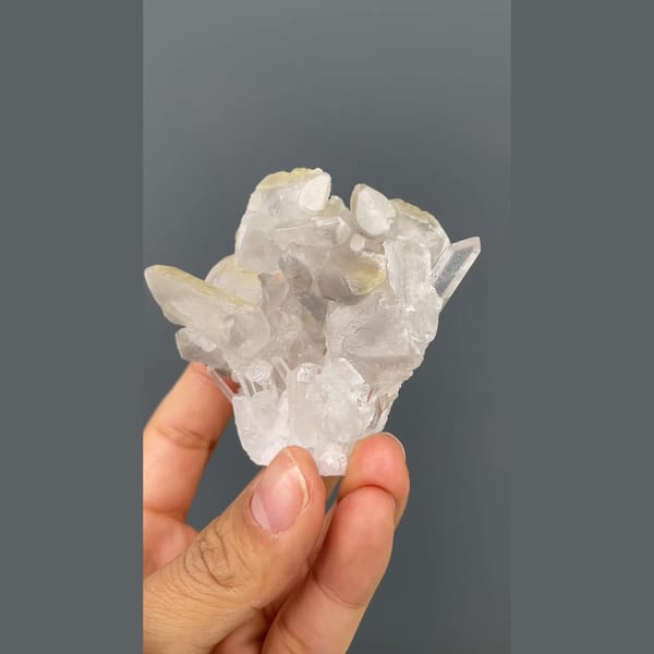 Glassy quartz cluster with white barite blades from Jinkouhe, Sichuan — alternate view