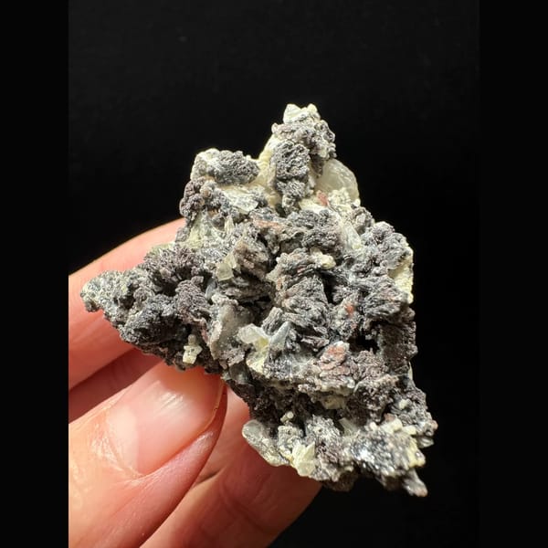 Petal calcite with specular hematite from Inner Mongolia — detail view