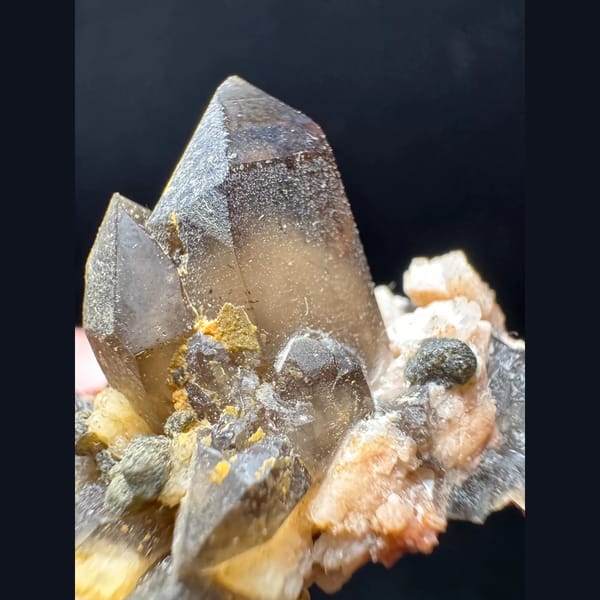 Smoky quartz with garnet from Yunxiao Fujian — detail view