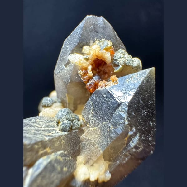 Smoky quartz with garnet from Yunxiao Fujian — detail view