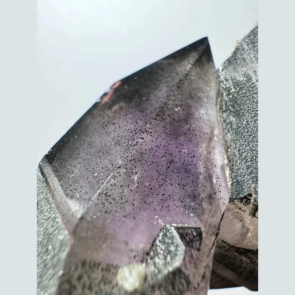 Green-skinned phantom amethyst with hematite from Inner Mongolia — detail view
