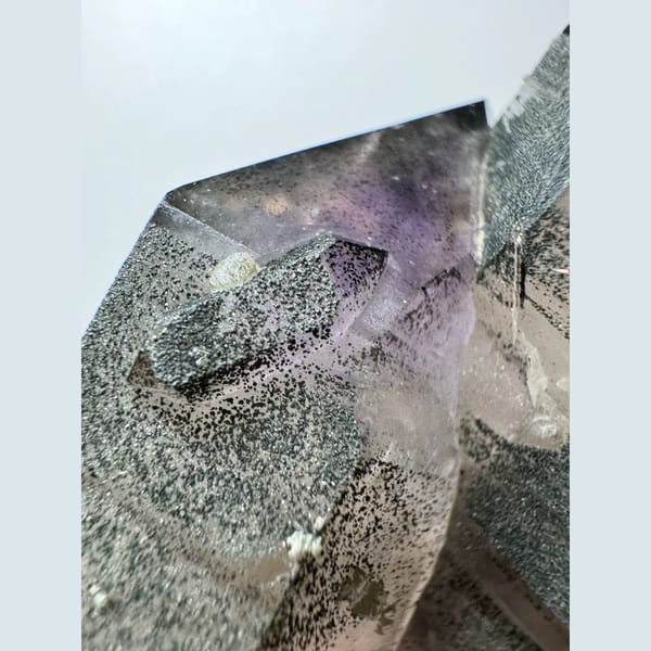 Green-skinned phantom amethyst with hematite from Inner Mongolia — detail view
