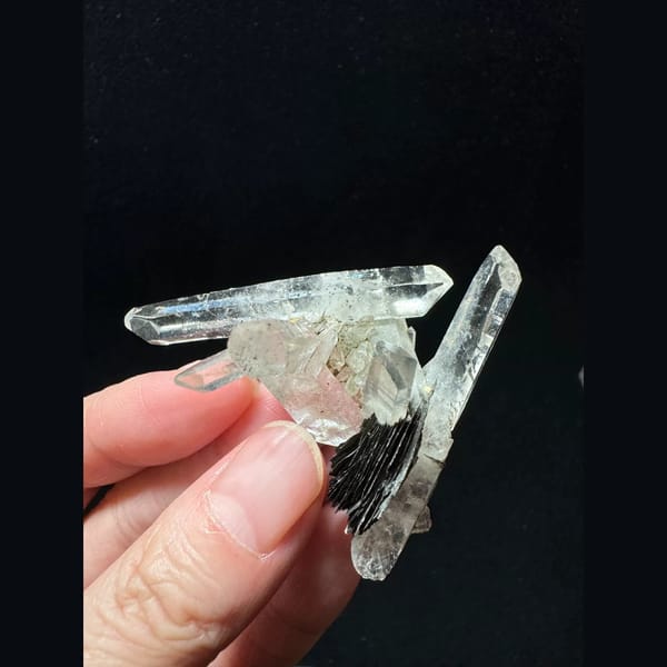 Double-terminated quartz cluster with hematite from Guangdong — complete view