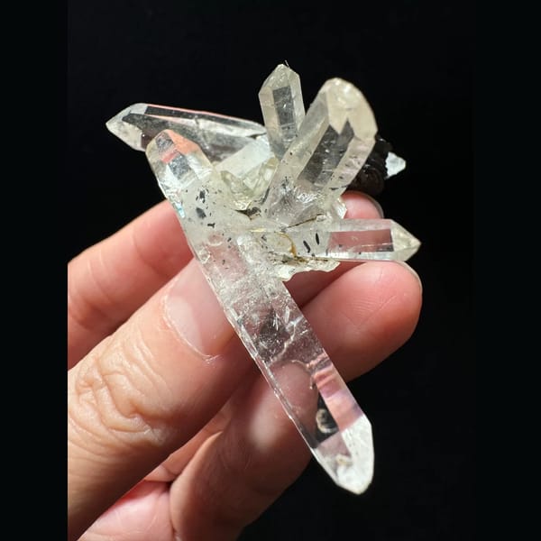 Double-terminated quartz cluster with hematite from Guangdong — alternate view