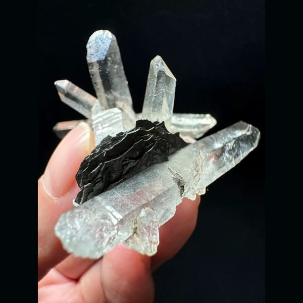 Double-terminated quartz cluster with hematite from Guangdong — alternate view