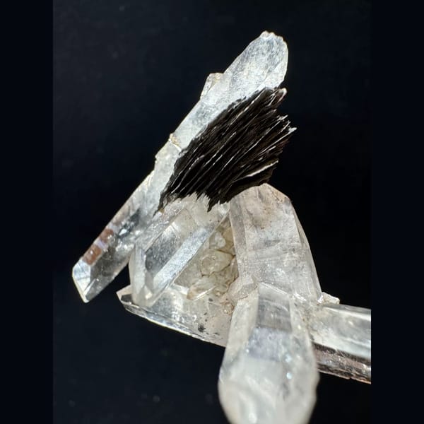 Double-terminated quartz cluster with hematite from Guangdong — detail view