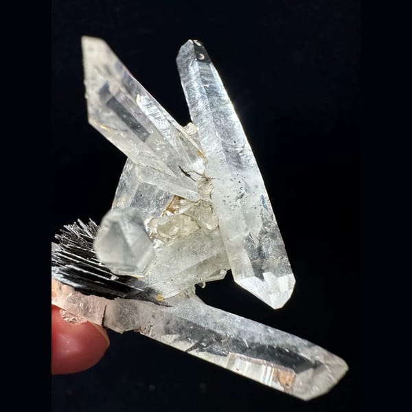 Double-terminated quartz cluster with hematite from Guangdong — detail view