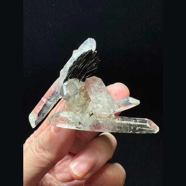 Double-terminated quartz cluster with hematite from Guangdong — detail view