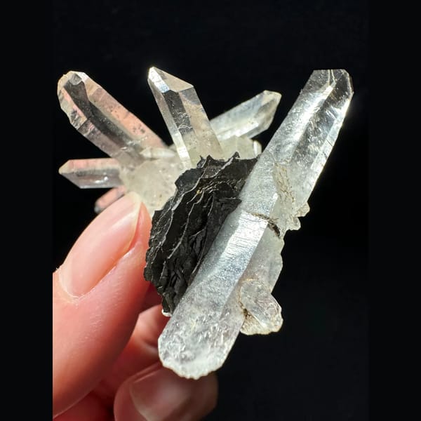 Double-terminated quartz cluster with hematite from Guangdong — detail view