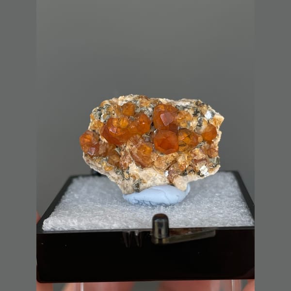 Bright orange spessartine garnet crystals from Yunxiao, Fujian — complete view