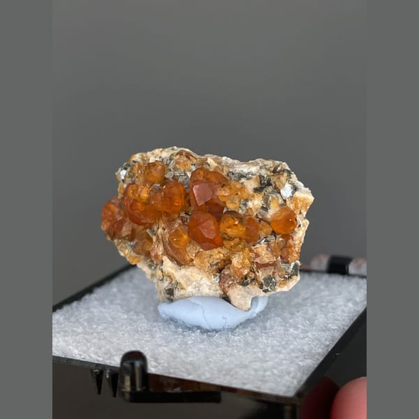 Bright orange spessartine garnet crystals from Yunxiao, Fujian — detail view