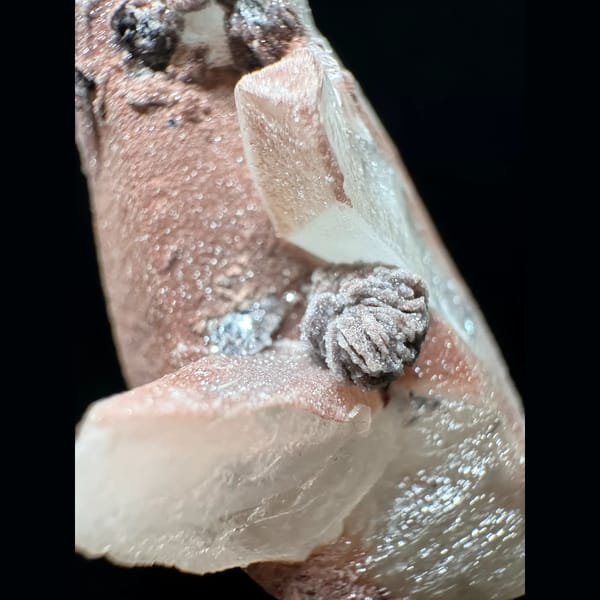 Pink-skinned quartz with petal calcite and hematite from Inner Mongolia — detail view