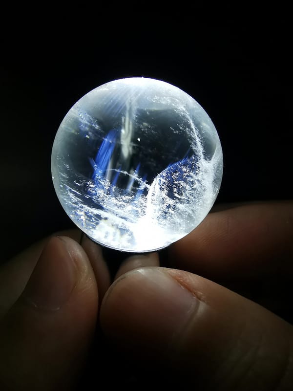 Blue Needle Quartz Sphere with Snow-Mountain Veil — complete mineral specimen view 1