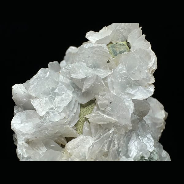 Large green-skinned quartz with petal calcite from Inner Mongolia — detail view