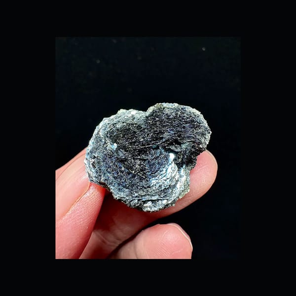 Specular hematite rosette on pale matrix from Inner Mongolia, complete front view