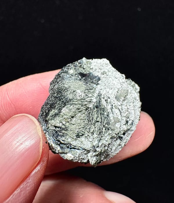 Specular hematite rosette on pale matrix from Inner Mongolia, complete reverse view