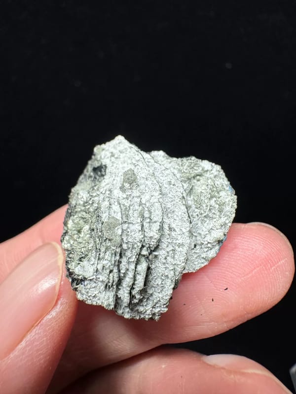 Specular hematite rosette on pale matrix from Inner Mongolia, complete side view