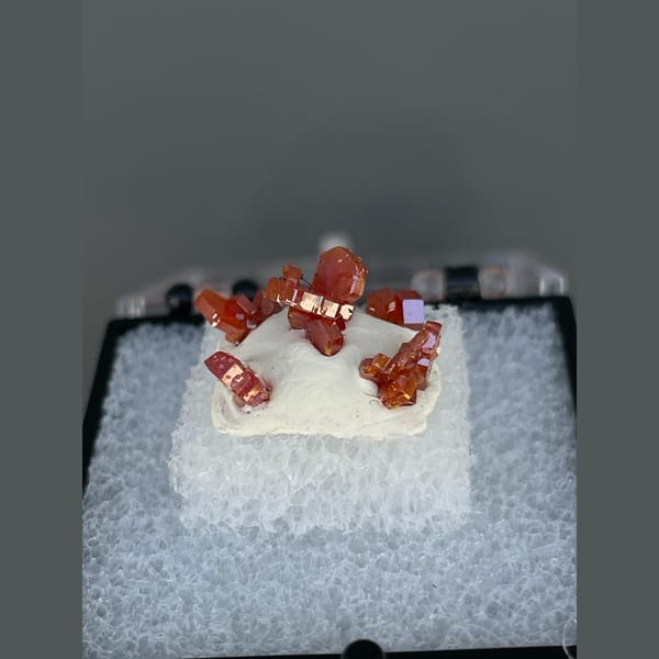Bright red hexagonal vanadinite crystals from Morocco — complete view