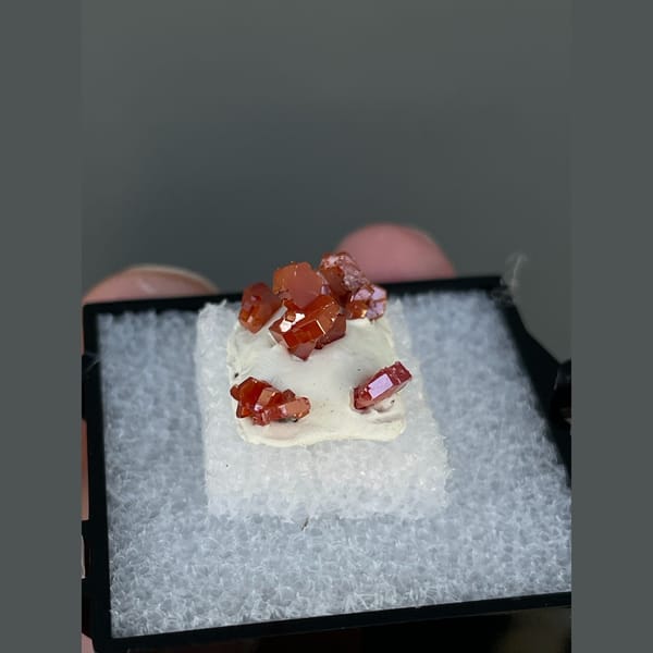 Bright red hexagonal vanadinite crystals from Morocco — alternate view