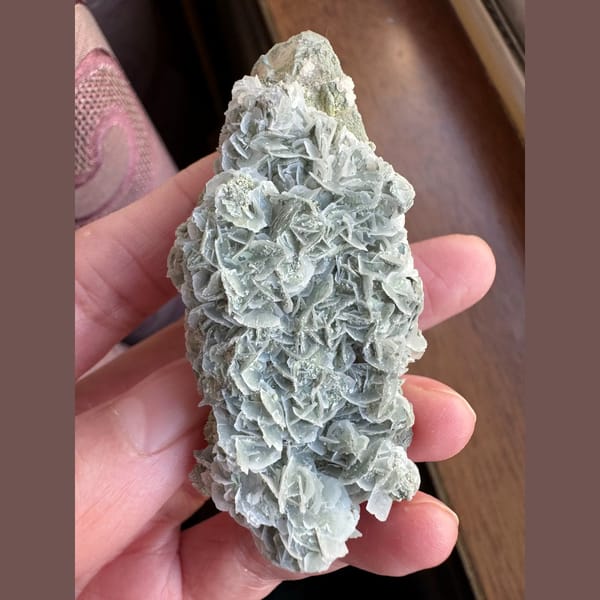 Quartz floater with blue-green petal calcite from Inner Mongolia — complete view
