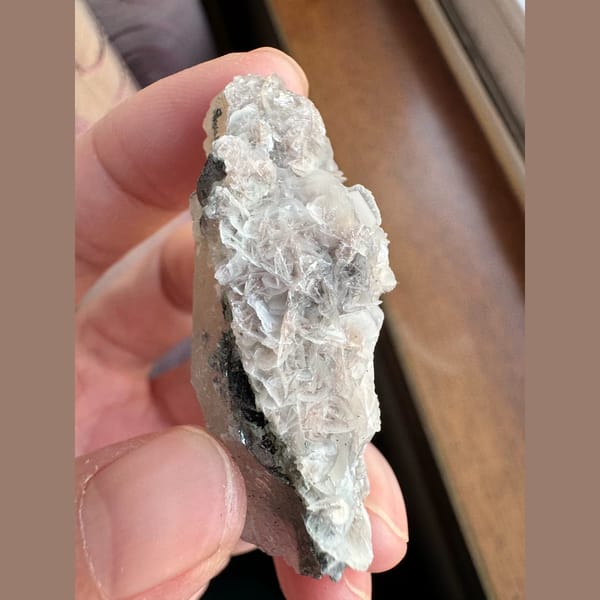 Quartz floater with pale pink petal calcite and hematite from Inner Mongolia — alternate view