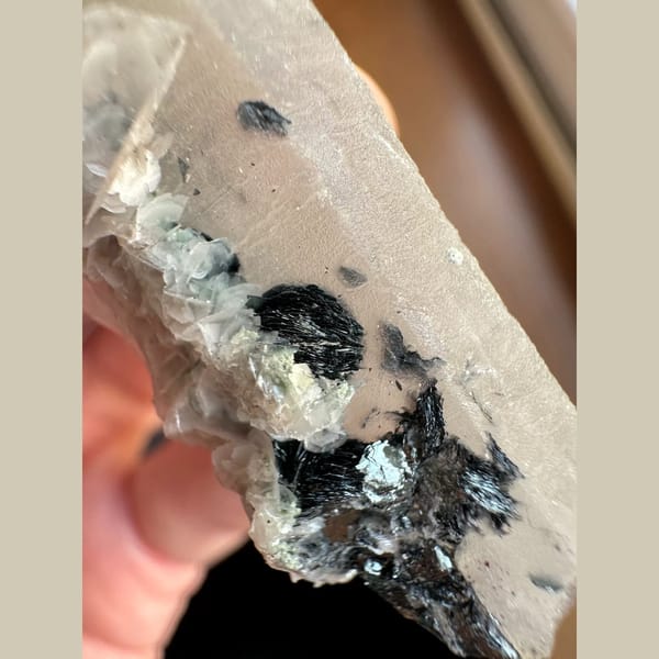 Quartz floater with pale pink petal calcite and hematite from Inner Mongolia — alternate view