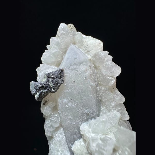 Quartz floater with white calcite and hematite from Inner Mongolia — alternate view