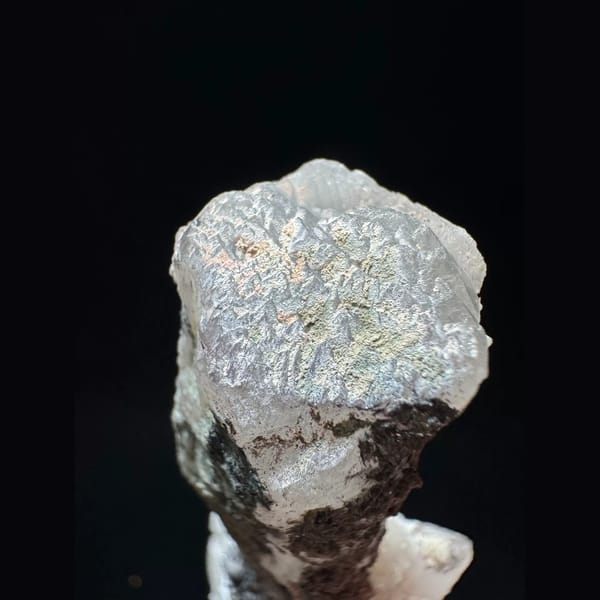 Quartz floater with white calcite and hematite from Inner Mongolia — detail view