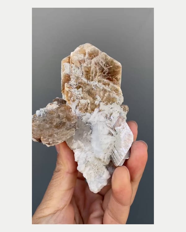 Complete right oblique view of golden mica with topaz