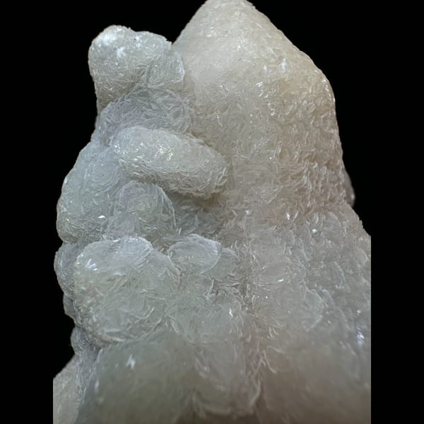 Quartz with lacy calcite crust from Inner Mongolia — detail view