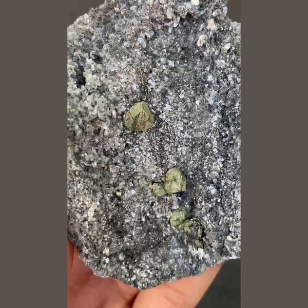 Kesterite with green mushistonite on a sparkling mica plate from Xuebaoding — alternate view