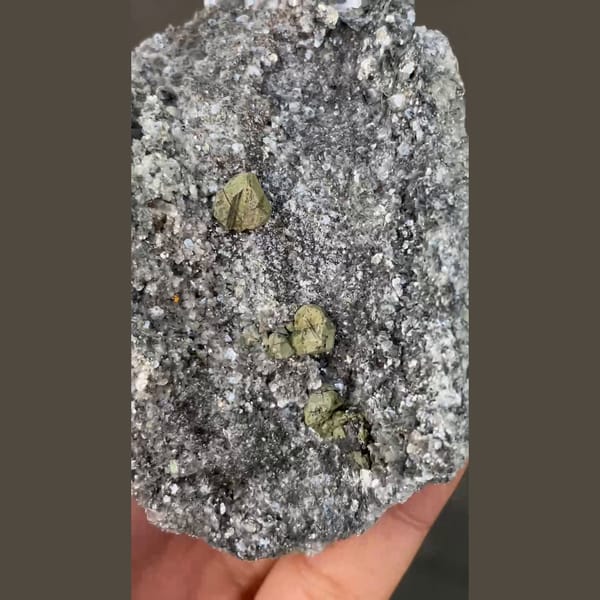 Kesterite with green mushistonite on a sparkling mica plate from Xuebaoding — alternate view