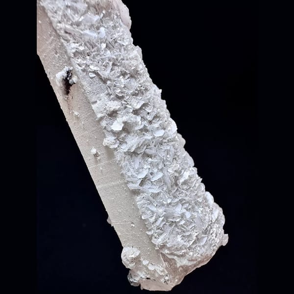 Quartz floater with pale pink petal calcite from Inner Mongolia — detail view