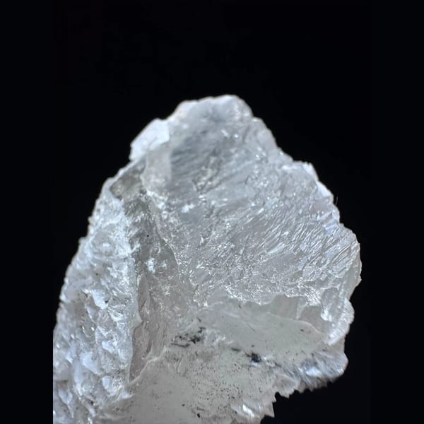 Quartz floater with pale pink petal calcite from Inner Mongolia — detail view