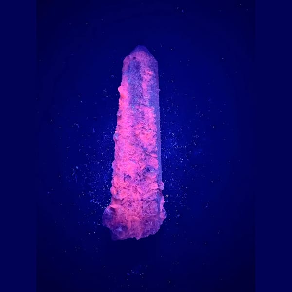 Quartz floater with pale pink petal calcite from Inner Mongolia — detail view